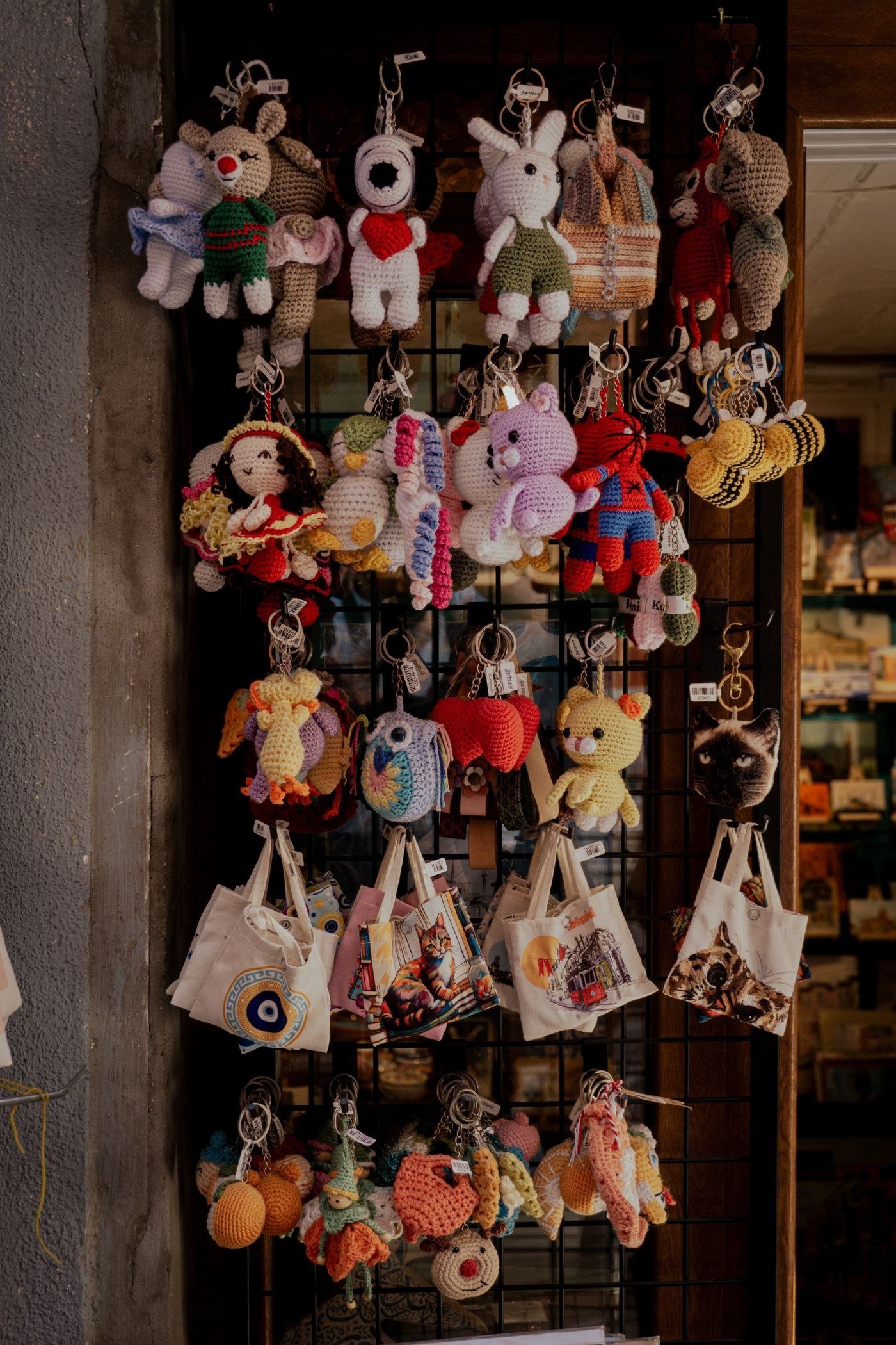 Handmade crochet keychains and bags on display