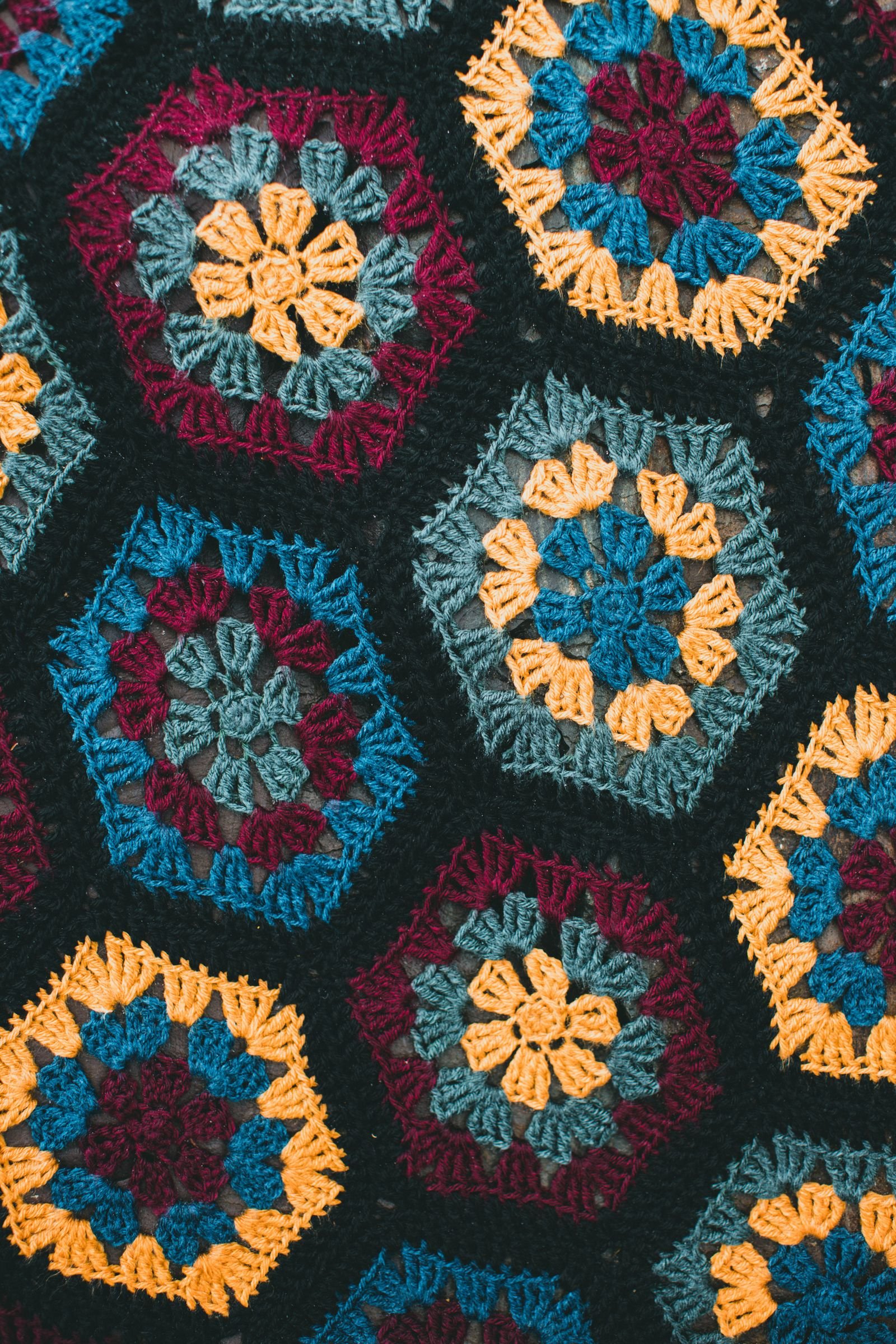 Detailed close-up of a colorful crochet pattern with hexagonal designs