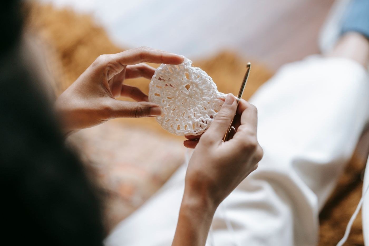 Crocheted fabric worked by hand, seen from above