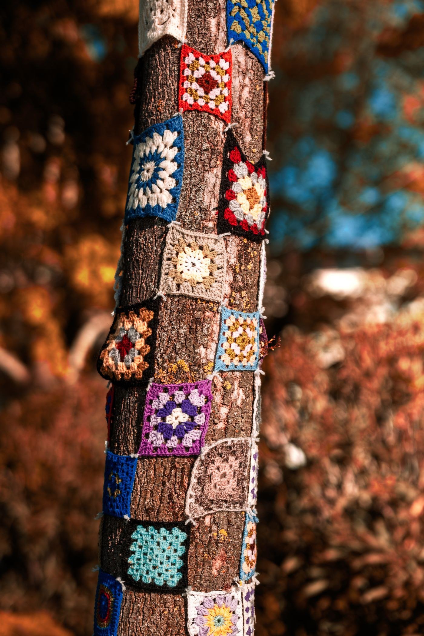 Colorful crochet patches in an autumn setting